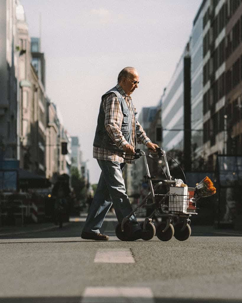 Man Using a Walker in a City Street